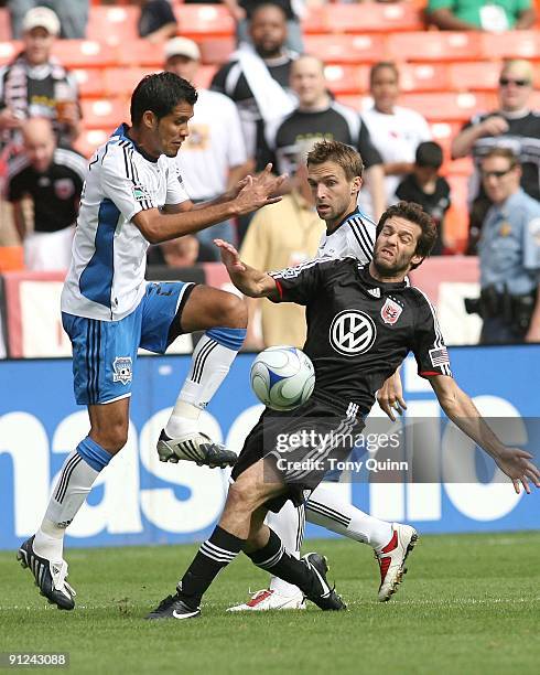 Ben Olsen of D.C. United loses the ball to Jason Hernandez of the San Jose Earthquakes during an MLS match at RFK Stadium on September 27, 2009 in...