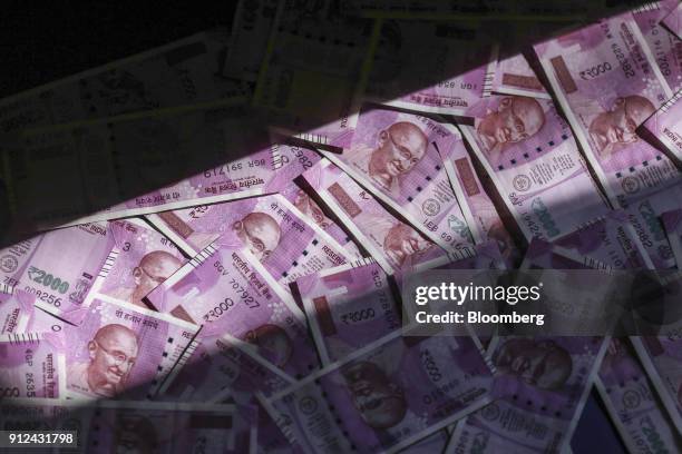 Indian two thousand rupee banknotes are arranged for a photograph in Mumbai, India, on Tuesday, Jan. 30, 2018. Indian Prime Minister Narendra...