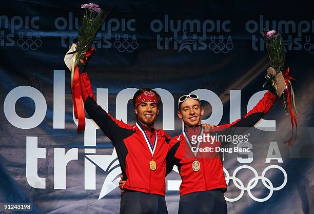 Apolo Anton Ohno, L, and Jordan Malone celebrate after finishing first and third respectively overall at the U.S. Short Track Speedskating...