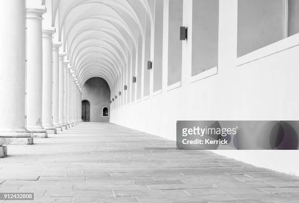 archway with many arches - patttern in monochrome black white - sandstone stock pictures, royalty-free photos & images