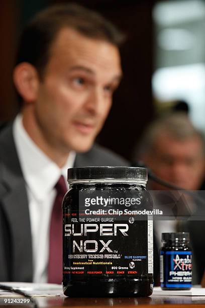 United States Anti Doping Agency CEO Travis Tygart displays two examples of dietary supplements while testifying before the Senate Judiciary...
