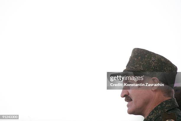 Belarusian President Alexander Lukashenko speaks to soldiers and officers during a military parade after combined military exercises on September 29,...