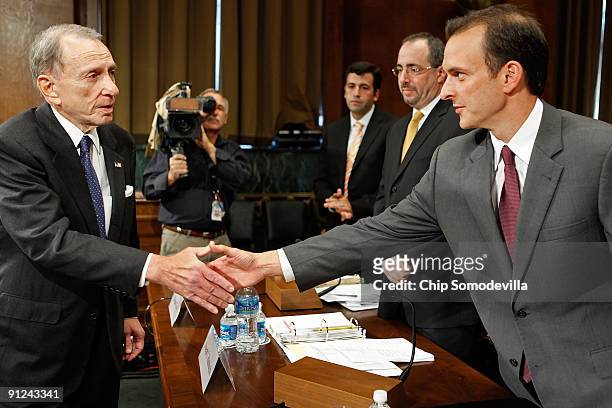 United States Anti Doping Agency CEO Travis Tygart is greeted by the Senate Judiciary Committee's Crime and Drugs Subcommittee Chairman Arlen Specter...