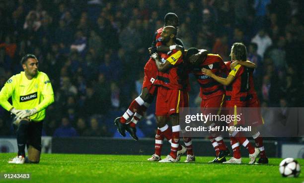 Frederic Kanoute of Sevilla celebrates with Didier Zokora during the UEFA Champions League Group G match between Rangers and Sevilla at Ibrox Stadium...