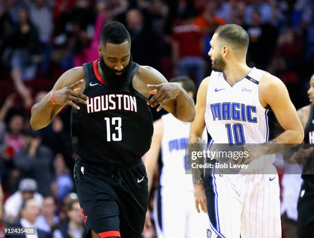 James Harden of the Houston Rockets motions after makling a three-point shot against the Orlando Magic at Toyota Center on January 30, 2018 in...