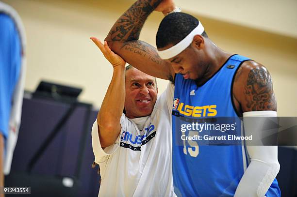 Strength and conditioning coach Steve Hess works with Carmelo Anthony of the Denver Nuggets during training camp on September 29, 2009 at the Pepsi...