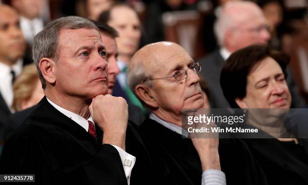 Supreme Court Chief Justice John G. Roberts , Associate Justice Stephen G. Breyer, and Associate Justice Elena Kagan listen to President Trump's...