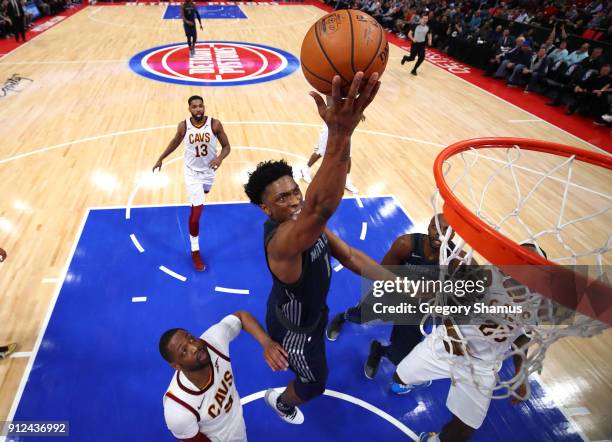 Stanley Johnson of the Detroit Pistons drives to the basket past Dwyane Wade of the Cleveland Cavaliers during the first half at Little Caesars Arena...