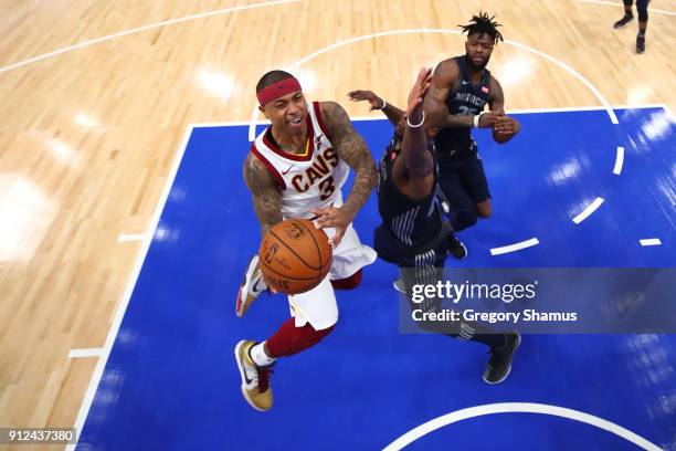 Isaiah Thomas of the Cleveland Cavaliers tries to get a shot off past Anthony Tolliver of the Detroit Pistons during the second half at Little...