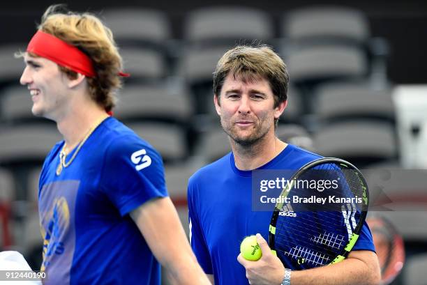 Team Captain Michael Kohlmann of Germany shares a laugh with Alexander Zverev during a practice session ahead of the Davis Cup World Group First...