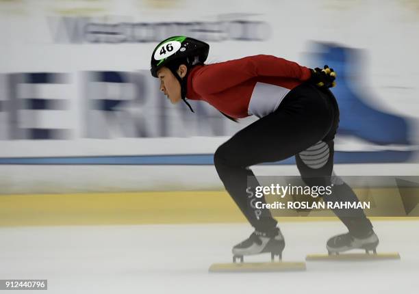 This photo taken on December 6, 2017 shows Singapore speed skater Cheyenne Goh skating during a training session at an ice rink in Singapore. In...