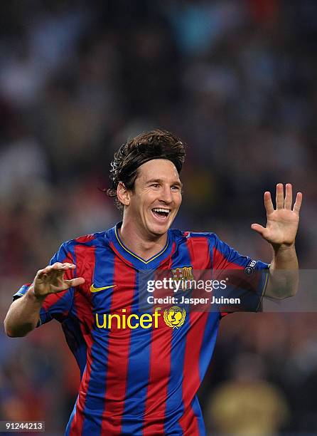 Lionel Messi of Barcelona celebrates scoring his sides opening goal during the Champions League group F match between Barcelona and Dynamo Kiev at...