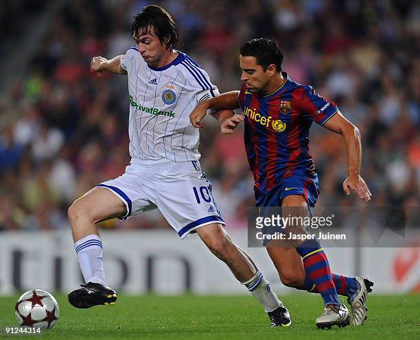 Xavier Hernandez of Barcelona duels for the ball with Artem Milevskiy of Dynamo Kiev during the Champions League group F match between Barcelona and...