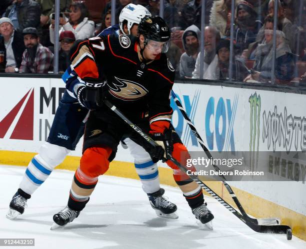 Hampus Lindholm of the Anaheim Ducks skates with the puck during the game against the Winnipeg Jets on January 25, 2018 at Honda Center in Anaheim,...