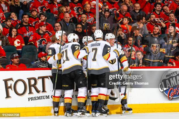 Teammates of the Vegas Golden Knights celebrate after winning in an NHL game on January 30, 2018 at the Scotiabank Saddledome in Calgary, Alberta,...