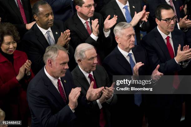 White House Cabinet members applaud as U.S. President Donald Trump, not pictured, delivers a State of the Union address to a joint session of...