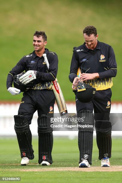 Peter Younghusband and Ollie Newton of the Firebirds leave the field after winning the Ford Trophy match between the Wellington Firebirds and the...