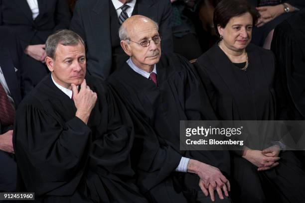The Supreme Court Justices, from bottom left, Chief Justice John Roberts, Stephen Breyer, and Elena Kagan listen during a State of the Union address...