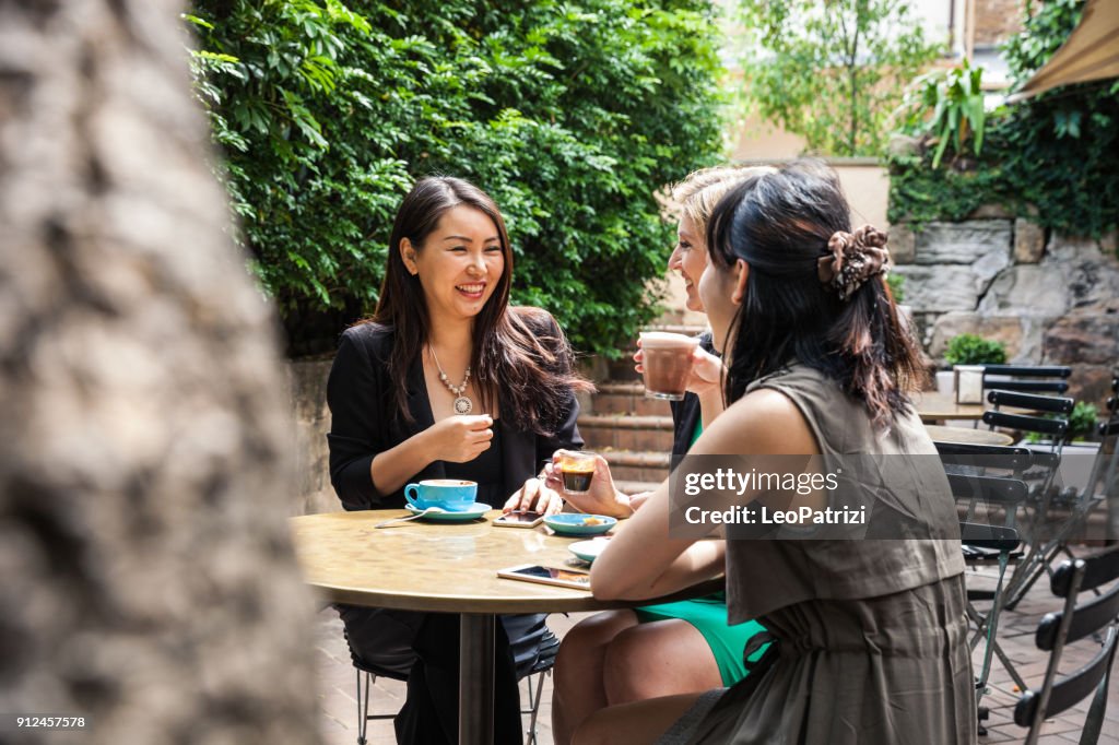 Group of multi-ethnic women drinking and chilling in a cafe in Sydney