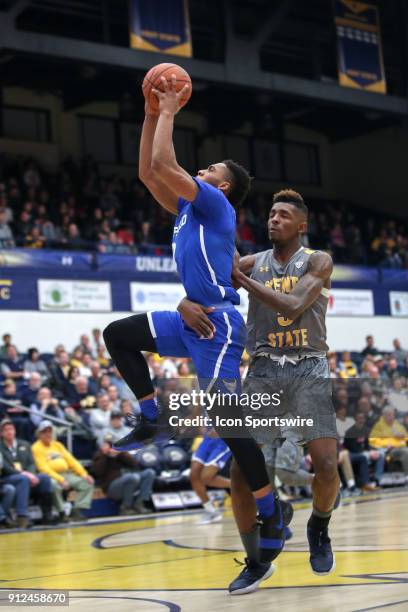 Buffalo Bulls guard Jayvon Graves is fouled by Kent State Golden Flashes forward Danny Pippen as he scores on a fast break during the first half of...