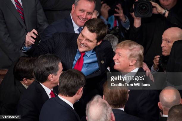President Donald Trump takes a selfie with Rep. Matt Gaetz, R-Fla., in the House chamber after Trump's State of the Union address to a joint session...