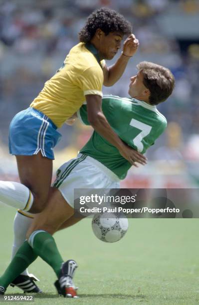 Northern Ireland defender Mal Donaghy stops Muller of Brazil during the FIFA World Cup match between Northern Ireland and Brazil at the Estadio...