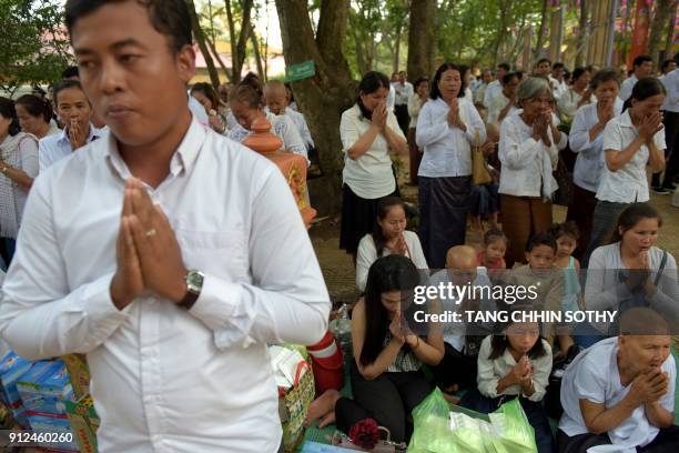 Cambodians pray during the Meak Bochea Buddhist celebration at the Oddong mountain in Kandal province, some 40 kilometers north of Phnom Penh on...