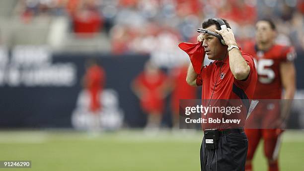 Head coach Gary Kubiak of the Houston Texans waits for the officials decision on whether the Houston Texans' running back fumbled before crossing the...