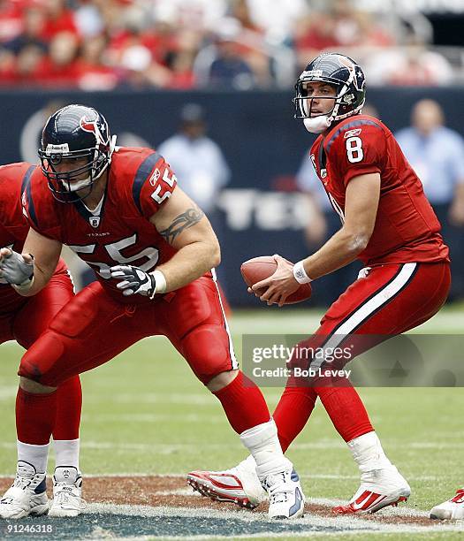 Quarterback Matt Schaub of the Houston Texans sets up behind center Chris Myers as he looks down-field for a receiver during the game against the...