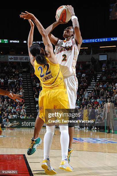 Swin Cash of the Seattle Storm goes up for a shot against Betty Lennox of the Los Angeles Sparks in Game Two of the Western Conference Semifinals...