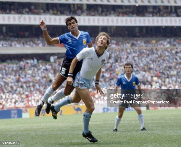 Terry Butcher of England is challenged by Jose Brown of Argentina during the FIFA World Cup quarter final match at the Aztec Stadium in Mexico City,...