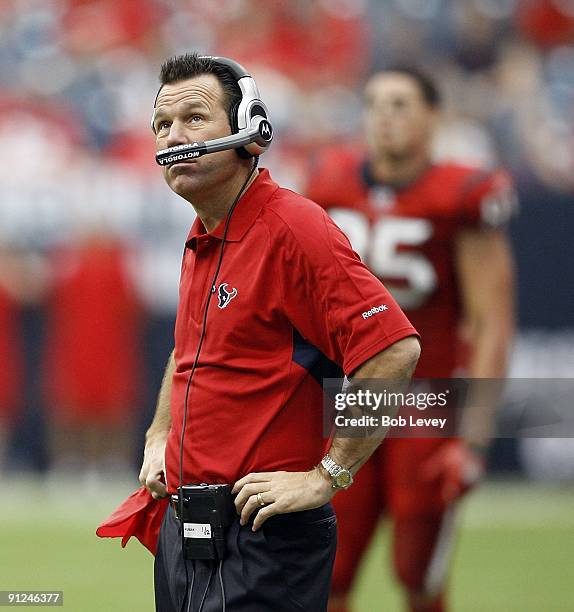 Head coach Gary Kubiak of the Houston Texans waits for the officials decision on whether a Houston Texans' running back fumbled the ball before...