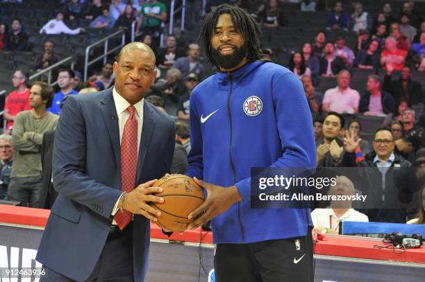 Coach Doc Rivers and DeAndre Jordan pose for a picture prior to a basketball game between the Los Angeles Clippers and the Portland Trail Blazers at...
