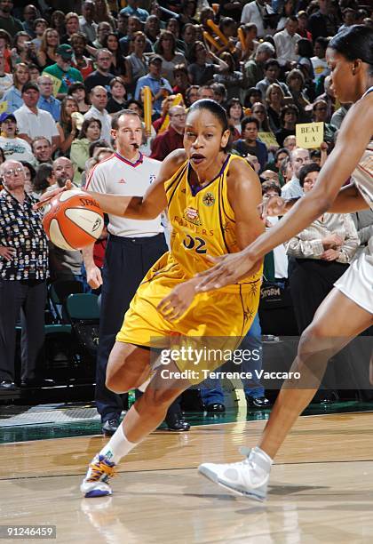 Tina Thompson of the Los Angeles Sparks drives to the basket in Game Two of the Western Conference Semifinals against the Seattle Storm during the...