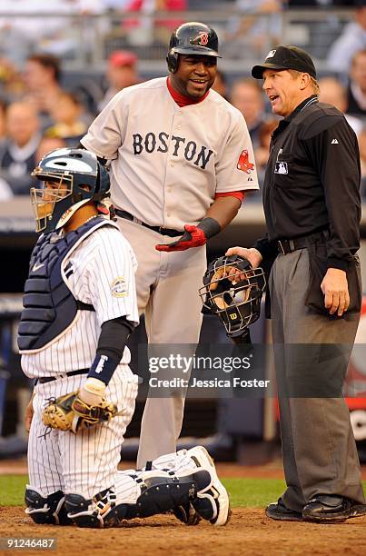 David Ortiz of the Boston Red Sox discusses a call with homeplate umpire Jeff Kellogg during the fifth inning of the game agains the New York Yankees...