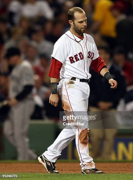 Dustin Pedroia of the Boston Red Sox reacts after he is caught stealing third base to end the third inning against the Toronto Blue Jays on September...