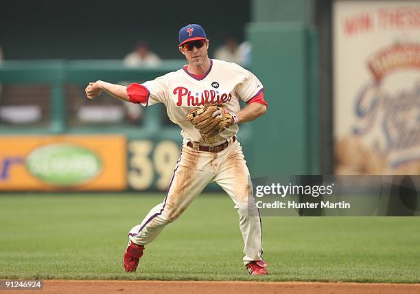 Second baseman Chase Utley of the Philadelphia Phillies throws to first base during a game against the Florida Marlins at Citizens Bank Park on...