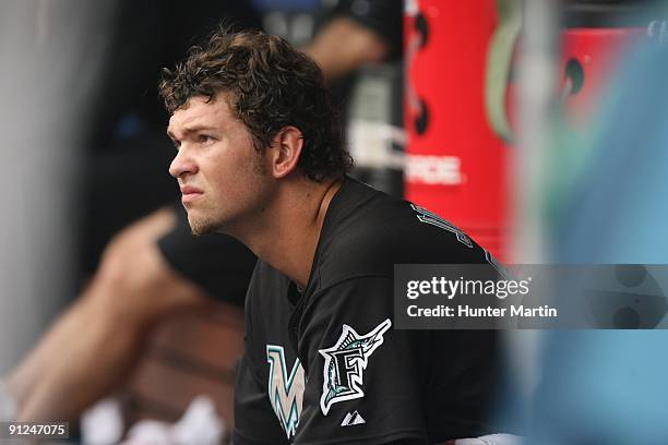 Starting pitcher Josh Johnson of the Florida Marlins sits in the dugout during a game against the Philadelphia Phillies at Citizens Bank Park on...