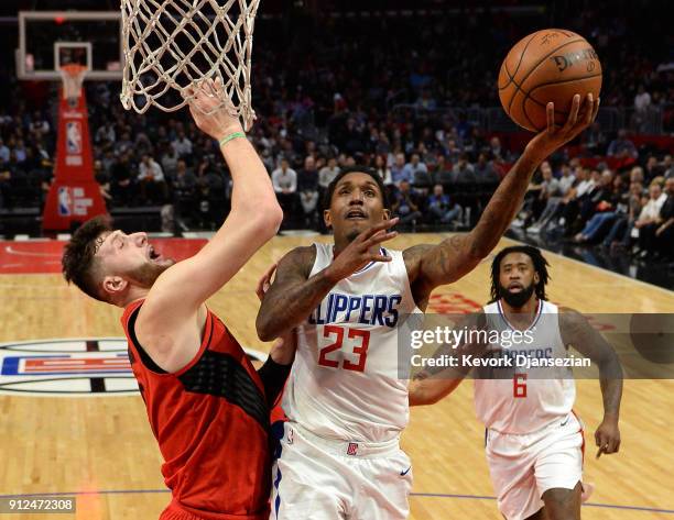 Lou Williams of the Los Angeles Clippers scores a basket against Jusuf Nurkic of the Portland Trail Blazers during the second half at Staples Center...