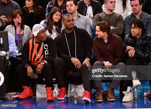 Tracy Morgan, Plaxico Burress, Luke Wilson and guest attend the New York Knicks vs Brooklyn Nets game at Madison Square Garden on January 30, 2018 in...