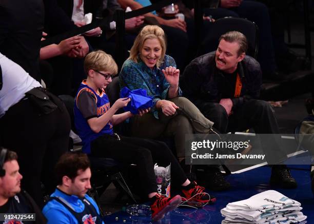 Anderson Falco and Edie Falco attend the New York Knicks vs Brooklyn Nets game at Madison Square Garden on January 30, 2018 in New York City.