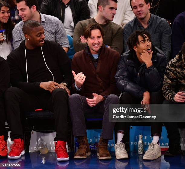 Plaxico Burress, Luke Wilson and guest attend the New York Knicks vs Brooklyn Nets game at Madison Square Garden on January 30, 2018 in New York City.