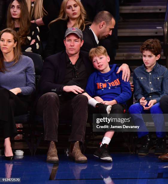 Ed Burns and Finn Burns attend the New York Knicks vs Brooklyn Nets game at Madison Square Garden on January 30, 2018 in New York City.