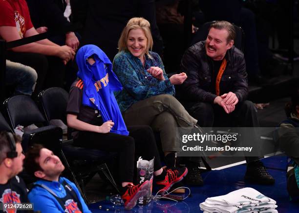 Anderson Falco and Edie Falco attend the New York Knicks vs Brooklyn Nets game at Madison Square Garden on January 30, 2018 in New York City.