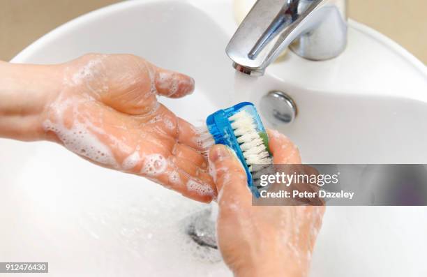 woman with ocd washing hands - obsessive stockfoto's en -beelden