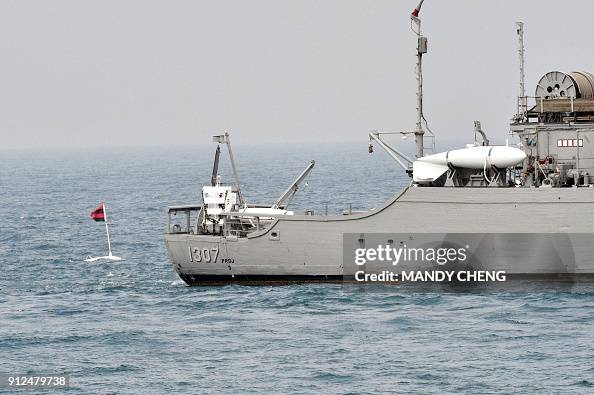 Lockheed Towed Array Towed array sonar devices are seen in the water and on board a Taiwan ...