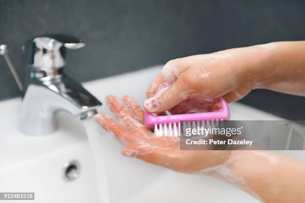 teenager with ocd washing hands - phobia imagens e fotografias de stock
