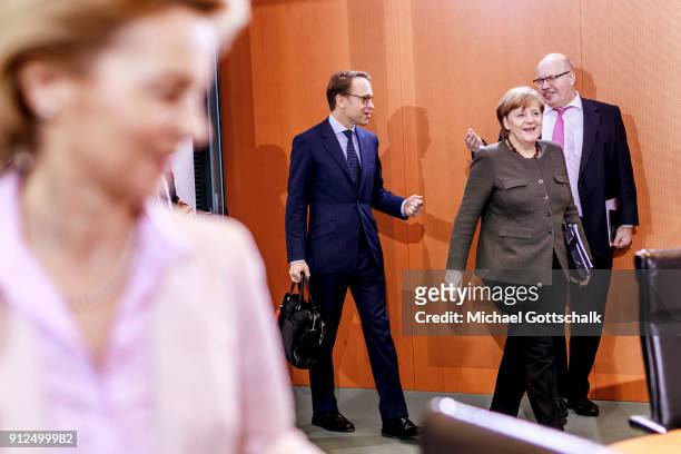 Berlin, Germany Jens Weidmann, president of German federal reserve bank Deutsche Bundesbank, German Chancellor Angela Merkel and Head of the German...
