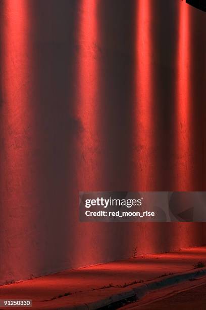 four red spotlights on a wall - red light district stock pictures, royalty-free photos & images