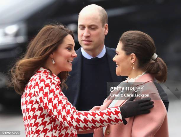 Catherine, Duchess of Cambridge is greeted by Crown Princess Victoria of Sweden as they visit the Karolinska Institute to meet with academics and...